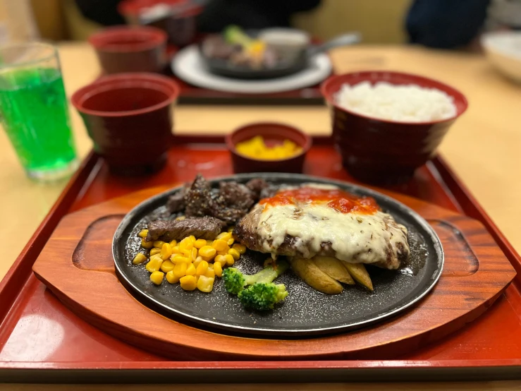 a close up of a plate of food on a tray, 奈良美智, steak, 8 k photo, college