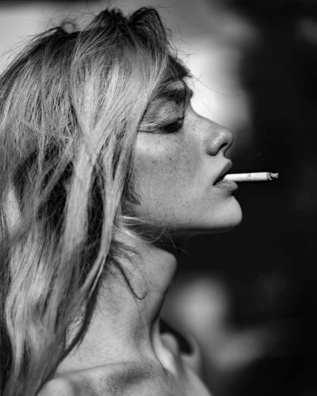 a woman with a cigarette in her mouth, a black and white photo, by Silvia Pelissero, unsplash, yvonne strahovski, hajime isayama, ffffound, with a cool pose