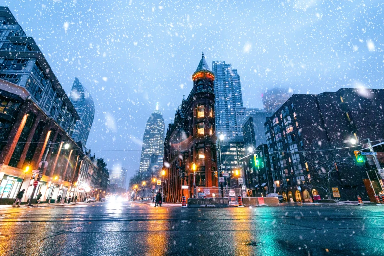 a street filled with lots of traffic next to tall buildings, by Julia Pishtar, pexels contest winner, light snowfall, the city of toronto, square, thumbnail