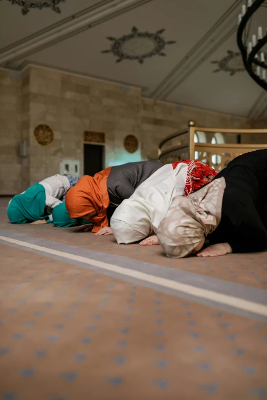 a group of people that are laying down on the ground, by Matthias Stom, hurufiyya, trump praying in mosque, profile image, performance, seasonal