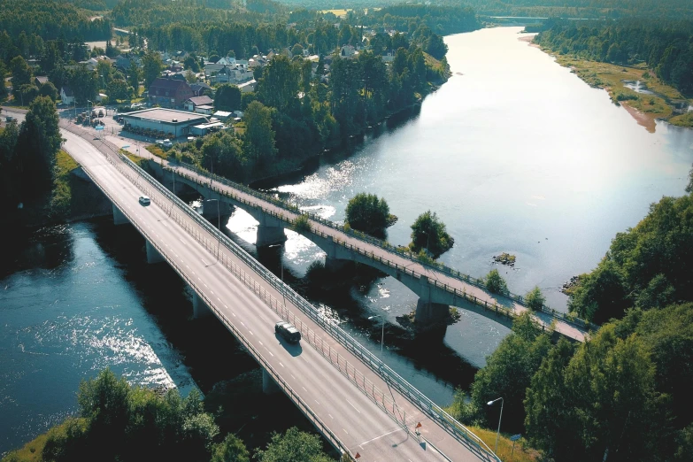 an aerial view of a bridge over a river, by Eero Järnefelt, unsplash, hurufiyya, 2 5 6 x 2 5 6 pixels, overpass, 🚿🗝📝