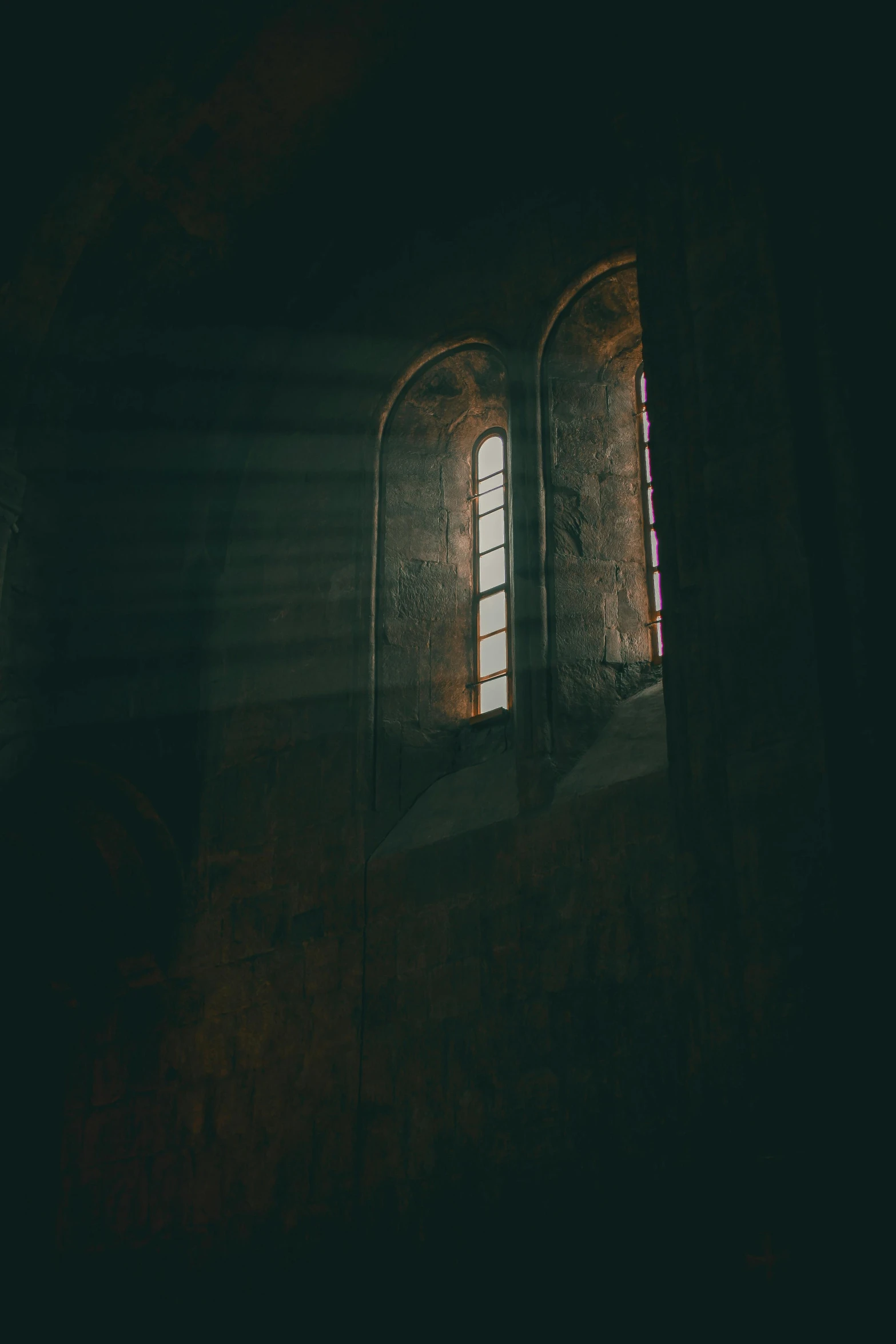 a couple of windows sitting next to each other, a picture, unsplash contest winner, light and space, dark gloomy church, instagram photo, ancient. atmospheric lighting, instagram picture