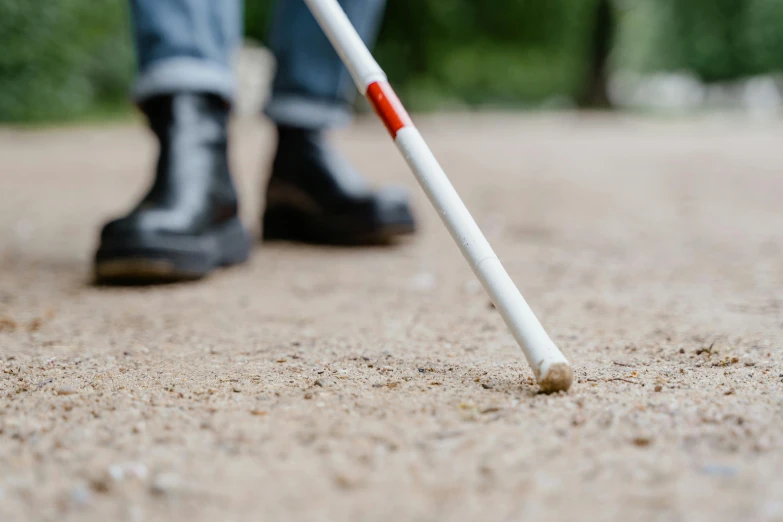 a close up of a person walking with a cane, subsurface scatter, looking at the ground, enhancements, australian