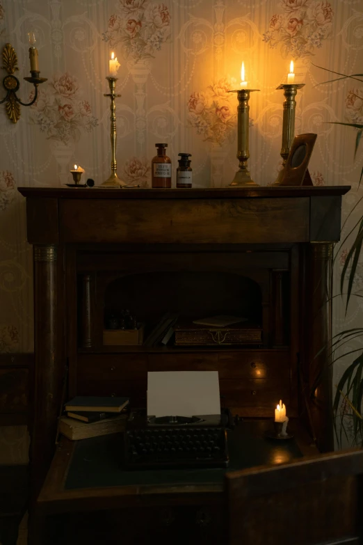 a laptop computer sitting on top of a wooden desk, inspired by Joseph Wright of Derby, romanticism, candles, 1 9 2 0 s room, chest, cottagecore