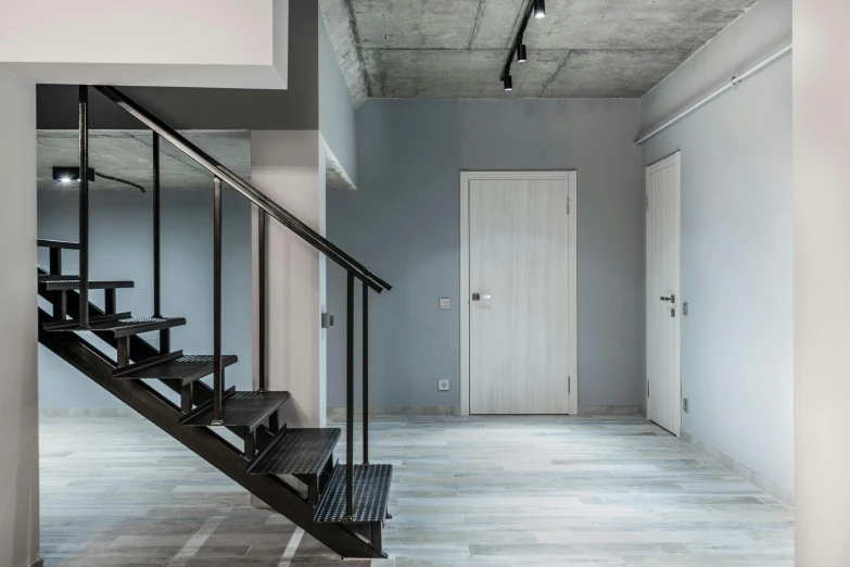 a room that has some stairs in it, by Adam Marczyński, unsplash, flat grey, neo kyiv, studio floor, dwell