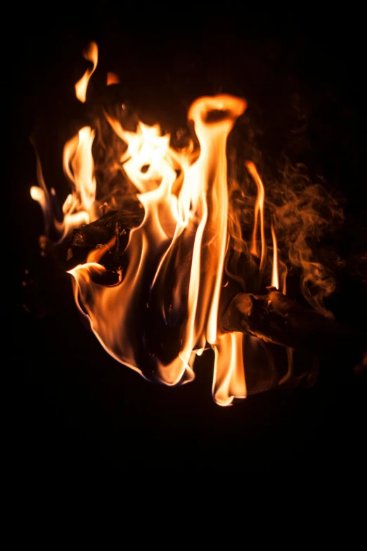 a close up of a fire in the dark, an album cover, unsplash, renaissance, instagram photo, high exposure photo, fire poi, a wooden