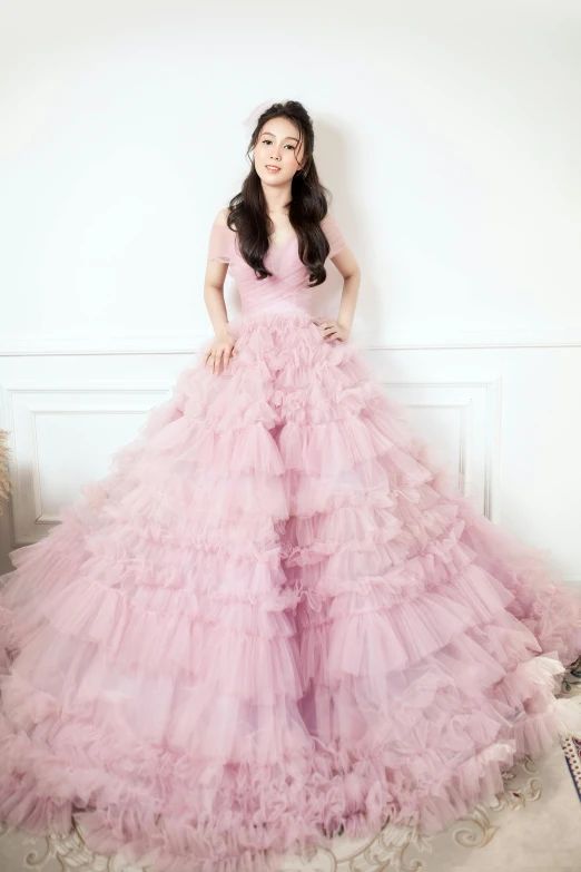 a woman in a pink dress posing for a picture, wearing organza gown, hana alisa omer, astri lohne, ue 6