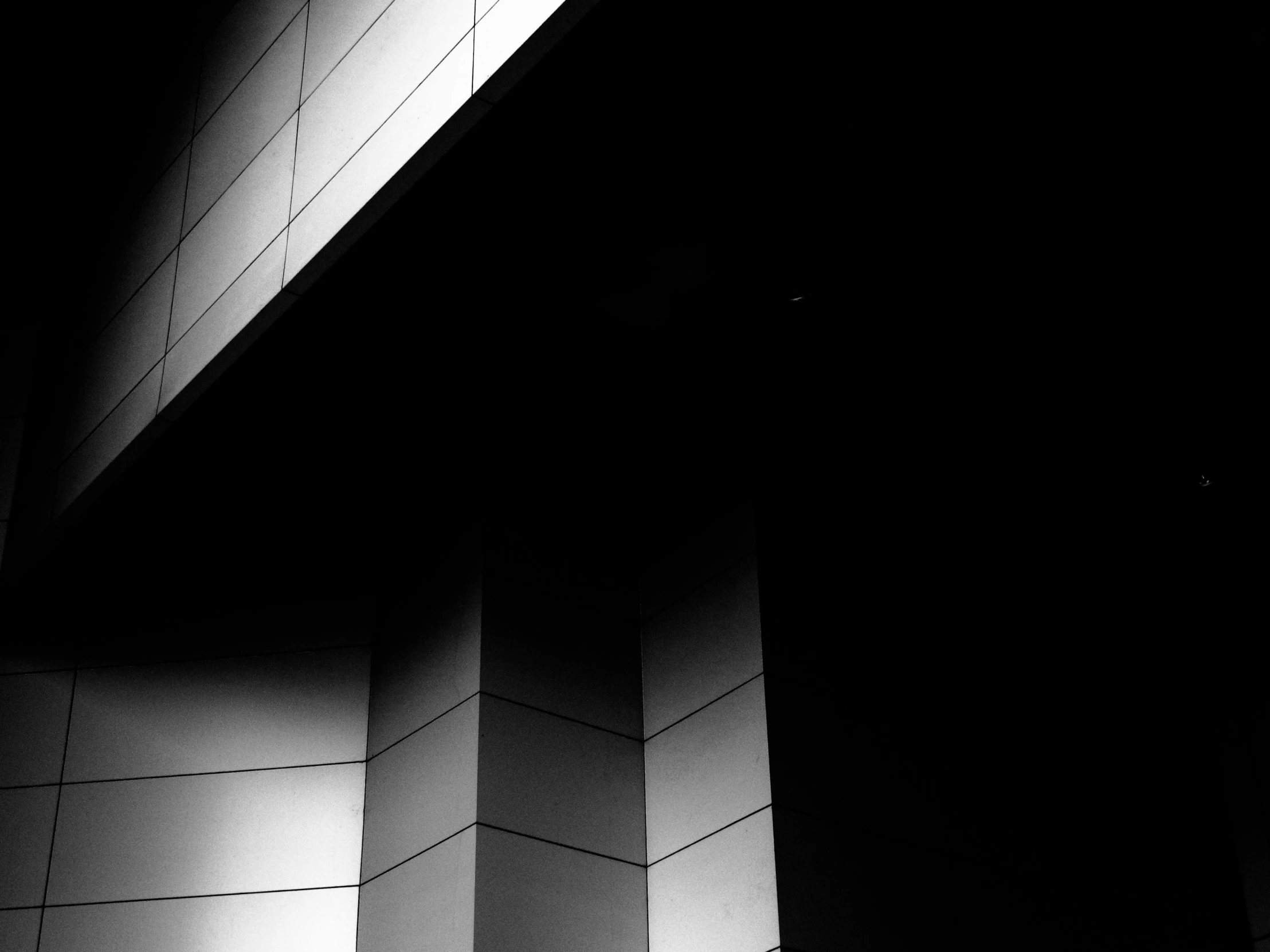 a black and white photo of a building, unsplash, light and space, square shapes, high contrast 8k, angled, monochrome color