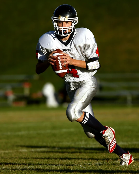 a football player running with the ball, by Everett Warner, shutterstock, renaissance, lgbtq, taken in the 2000s, teenager, tom brady
