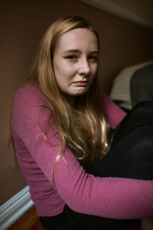 a woman in a pink shirt and black pants, a portrait, by Grace Polit, flickr, portrait of depressed teen, ap news photograph, sophie turner, f/1.8