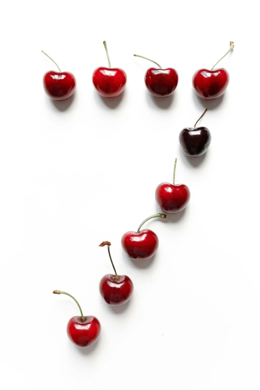 a heart made out of cherries on a white surface, by Julian Allen, letterism, key art, in a row, promo image, edible