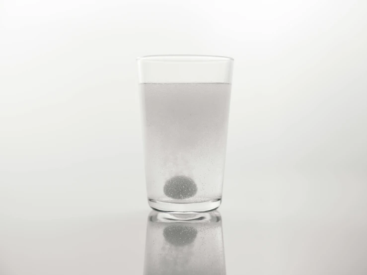a glass of water sitting on top of a table, inspired by Vija Celmins, kinetic pointillism, gunpowder smoke, pincushion lens effect, eye - level medium - angle shot, cannonballs