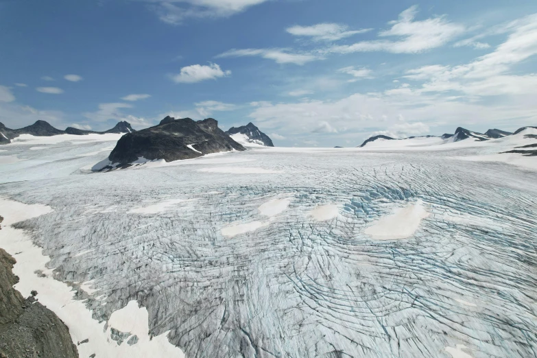 a large glacier with snow and mountains in the background, by Werner Andermatt, pexels contest winner, hurufiyya, drone footage, norwegian landscape, cgi 8k, mountains of ice cream