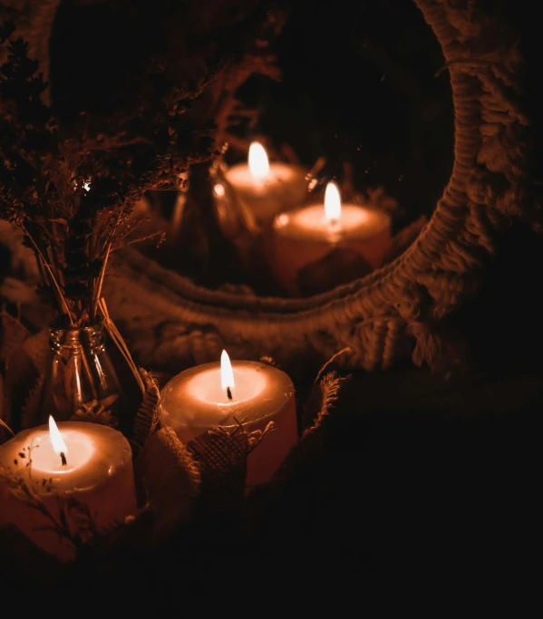 a bunch of candles that are sitting in front of a mirror, an album cover, inspired by Elsa Bleda, trending on pexels, baroque, witchy, night lighting, autumn season, 8 k sensual lighting