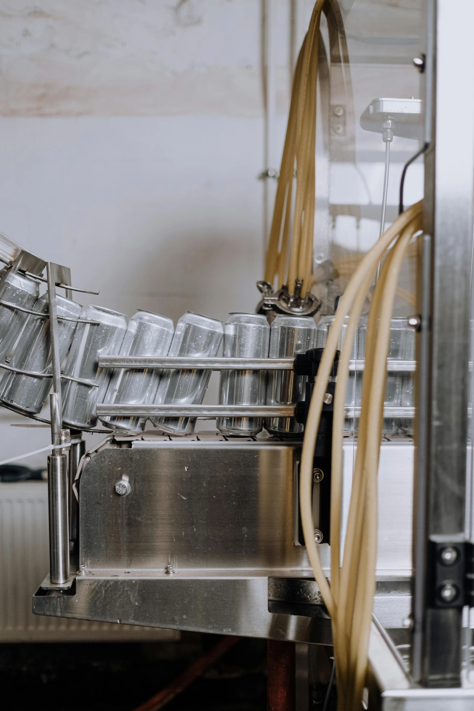 a machine that has some pasta in it, unsplash, process art, holding beer bottles, feed troughs, high quality photo, grey