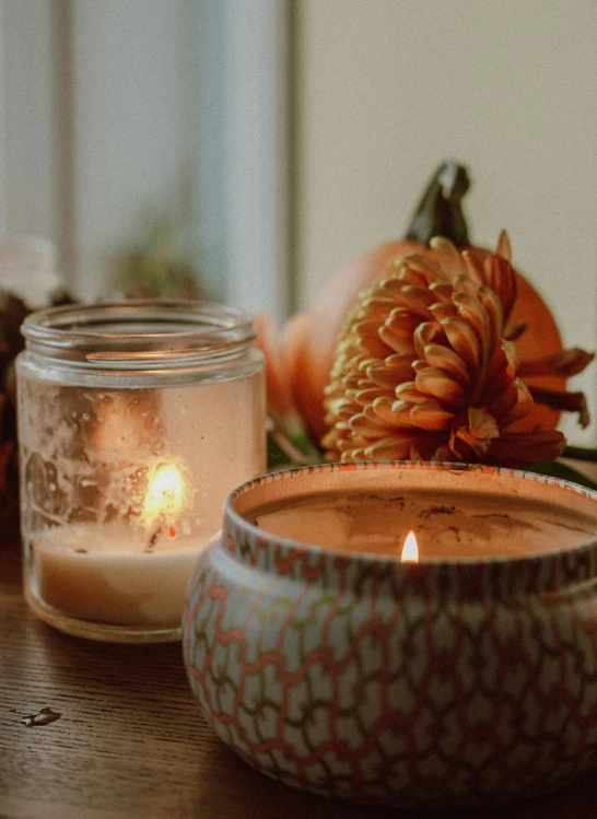 a candle sitting on top of a wooden table, profile image, harvest fall vibrance, promo image, curated collection