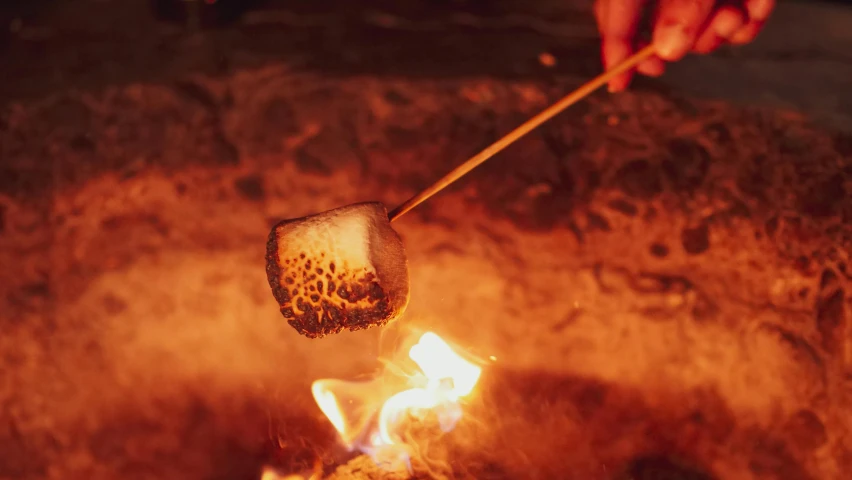 a person roasting marshmallows over a fire, trending on pexels, “ iron bark, instagram story, dessert, molten metal house