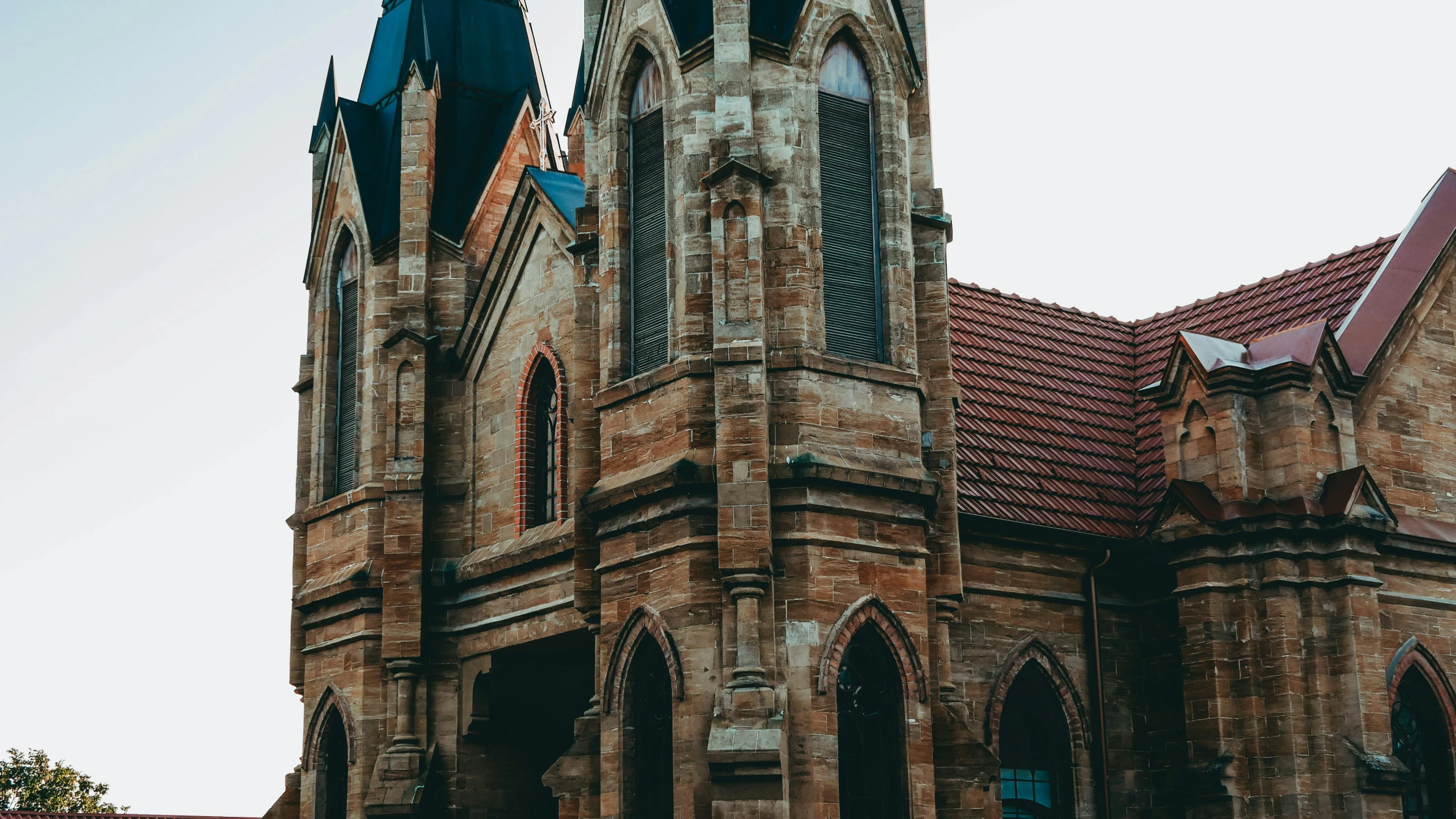 a couple of people that are standing in front of a building, by Adam Marczyński, pexels contest winner, romanesque, gothic revival, background image, church background!, in chippendale sydney