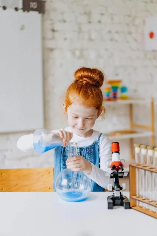 a little girl making a science experiment in a lab, pexels contest winner, portrait of a red haired girl, gif, profile picture, bong