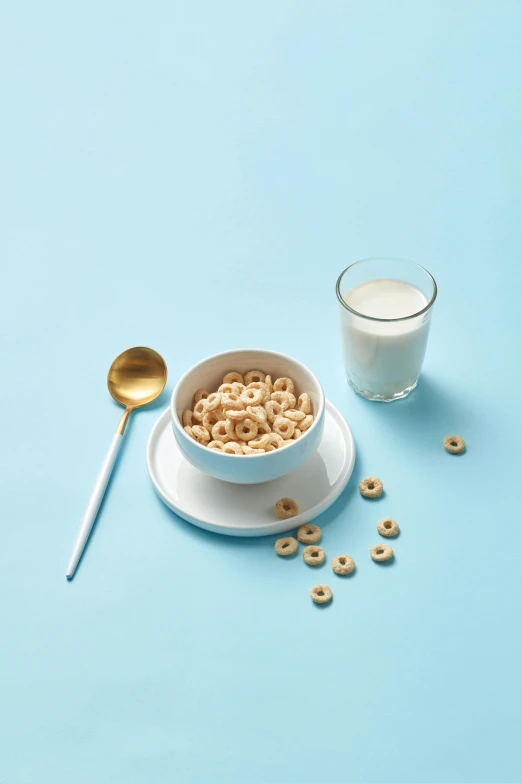 a bowl of cereal next to a glass of milk, by Ben Zoeller, gold plated, lifestyle, flat, vanilla