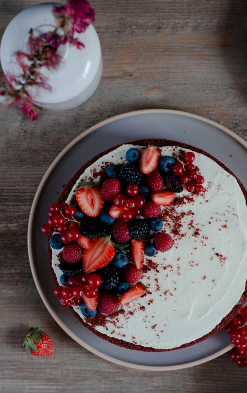 a cake with strawberries and blueberries on a plate, unsplash, red velvet, thumbnail, ready - made, brown