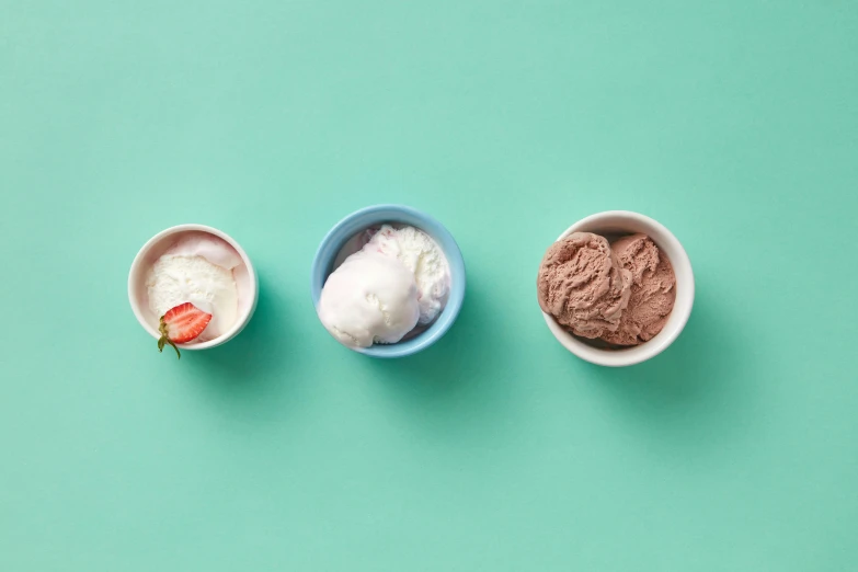 three bowls filled with different types of ice cream, a still life, inspired by Giorgio Morandi, trending on unsplash, birdseye view, mint, minimalist photorealist, chocolate