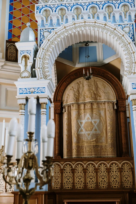 a chandelier hanging from the ceiling of a building, religious robes, decorated with russian motifs, hebrew, with kerala motifs