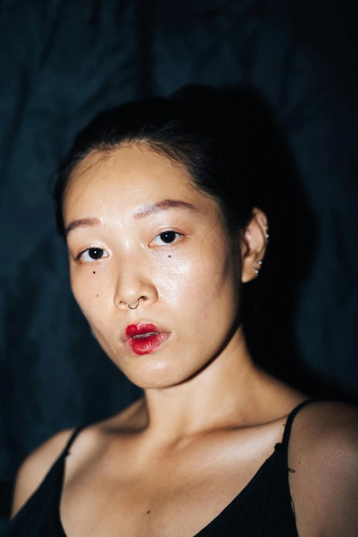 a close up of a person with a cell phone, an album cover, inspired by Ren Hang, hyperrealism, police lights shine on her face, thick red lips, ethnicity : japanese, sweaty face