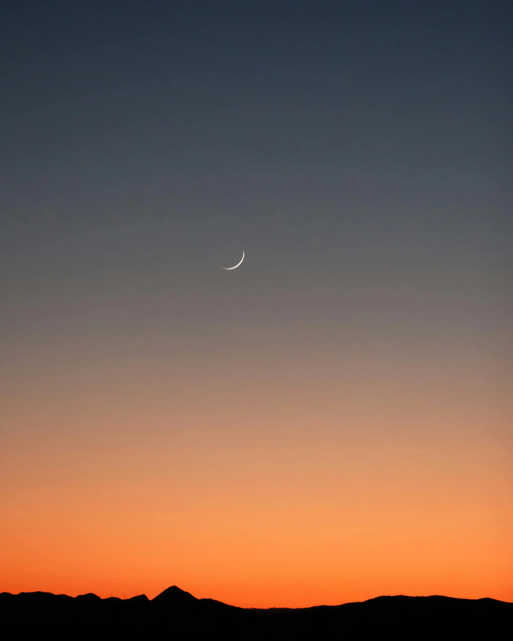 the moon is setting in the sky over the mountains, a minimalist painting, by Attila Meszlenyi, unsplash contest winner, postminimalism, smiling, crescent moon, gradient orange, low - angle shot