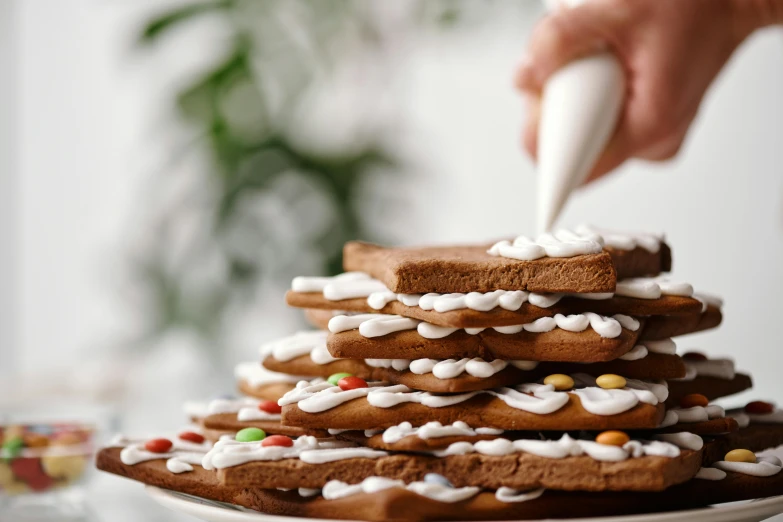 a close up of a plate of cookies on a table, giant white tree, sleek hands, glue dropping, piping