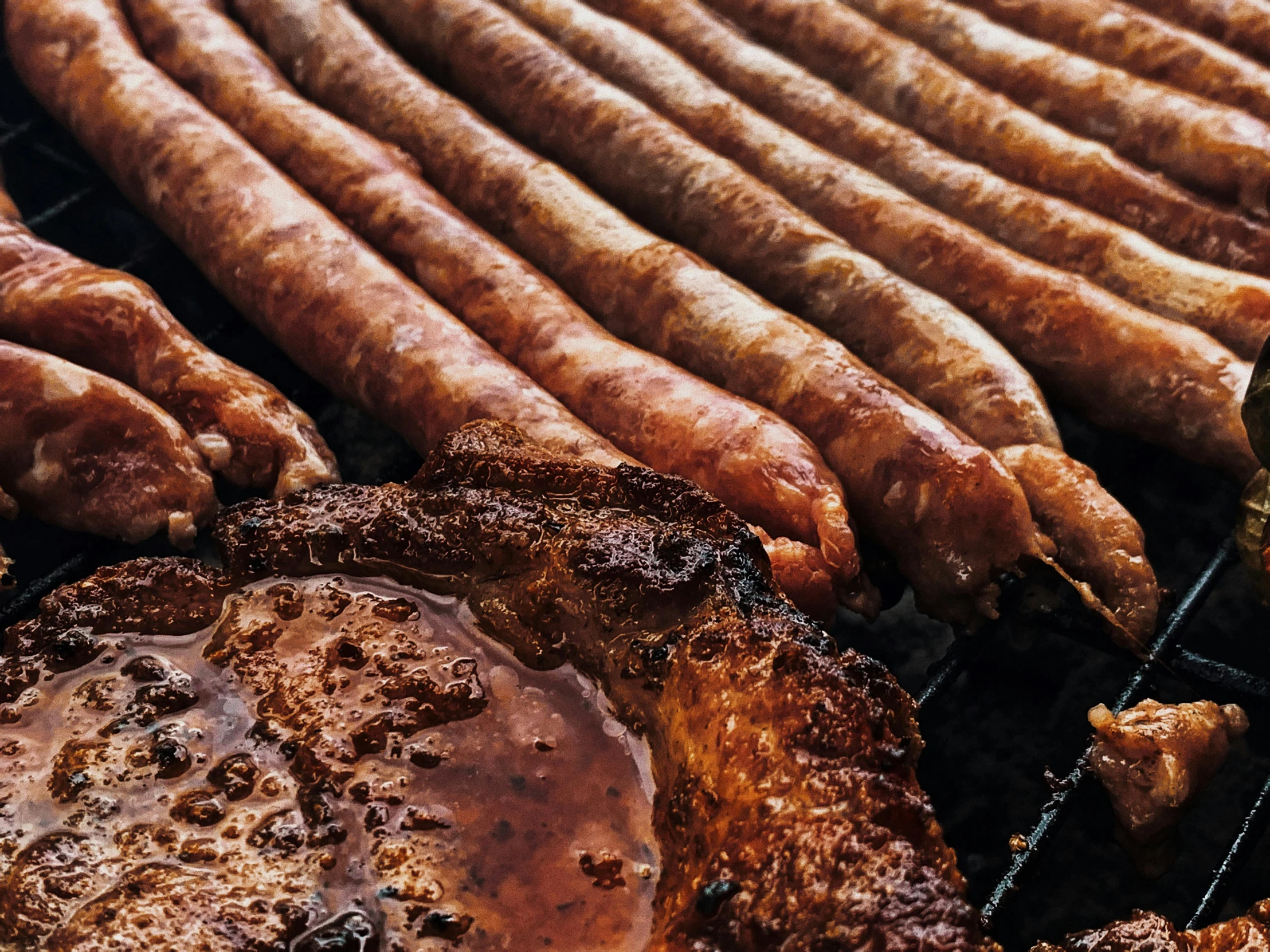 a bunch of sausages are cooking on a grill, by Joe Bowler, pexels contest winner, in sao paulo, profile image, ground meat, thumbnail