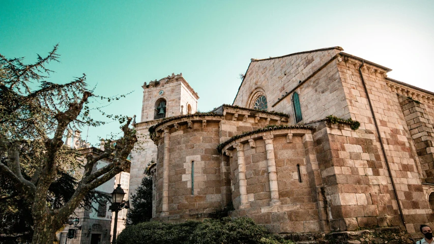 a couple of people that are standing in front of a building, inspired by Bernardo Daddi, pexels contest winner, romanesque, jesus alonso iglesias, built into trees and stone, exterior view, 2 5 6 x 2 5 6