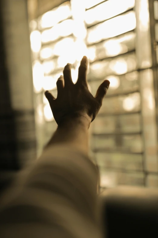 a person reaching out of a window with their hands, happening, stood in a cell, hazy, clenched fist, claw