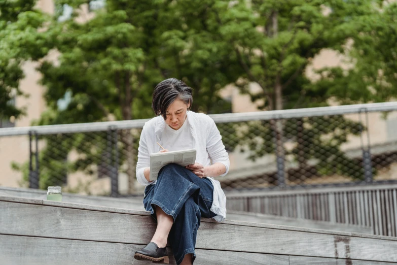 a woman sitting on a set of stairs reading a book, a drawing, by Mei Qing, pexels contest winner, sitting on a park bench, aged 4 0, dwell, maggie cheung