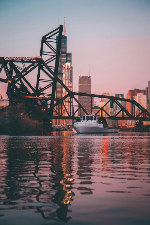 a boat floating on top of a river next to a bridge, by Greg Rutkowski, pexels contest winner, minneapolis as background, pink golden hour, well built, port scene background