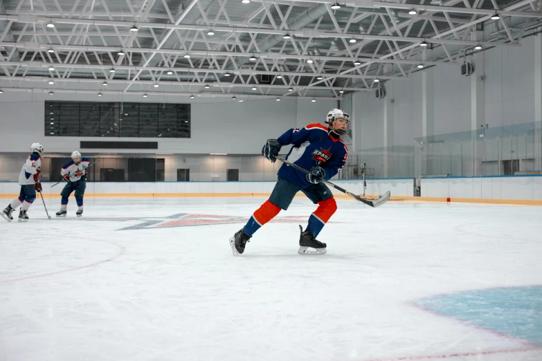 a group of young men playing a game of ice hockey, pexels contest winner, danube school, panoramic shot, athletic footage, 🦩🪐🐞👩🏻🦳, full body image