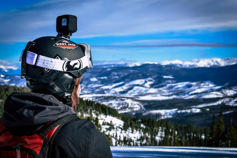 a man standing on top of a snow covered slope, a portrait, by Marshall Arisman, unsplash, vr helmet on man, overlooking, close-up shot from behind, instagram post