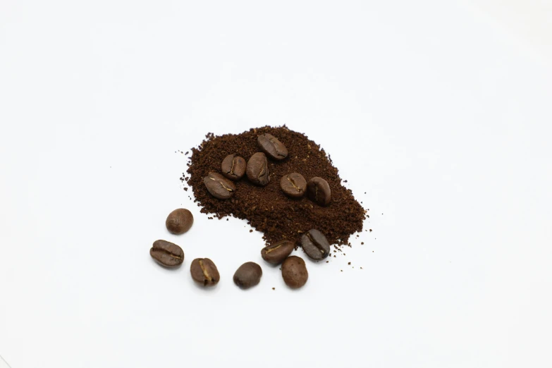 a pile of coffee beans next to a pile of ground, a stipple, reddit, hurufiyya, set against a white background, detailed product image, medium format, alessio albi