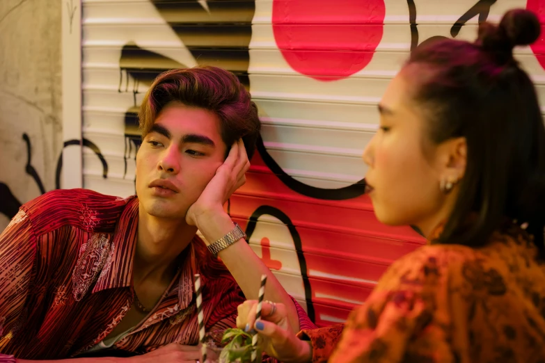 a man and a woman sitting at a table, trending on pexels, realism, 8 0 s asian neon movie still, lisa frank & sho murase, gen z, thailand