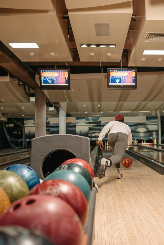 a man riding a bike down a bowling alley, stockholm, hypersphere, hammershøi, demur