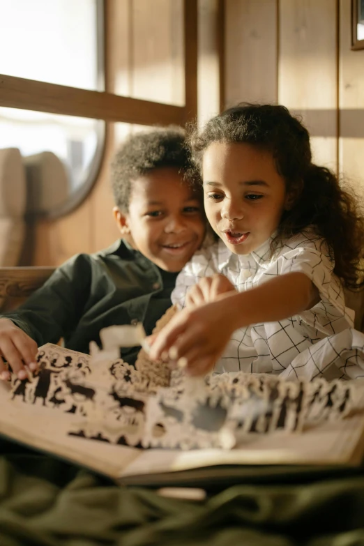 a couple of kids sitting on top of a bed, pexels contest winner, folk art, kirigami, tabletop gaming, map, 15081959 21121991 01012000 4k