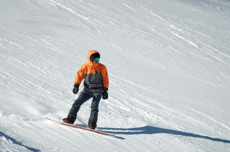 a man riding a snowboard down a snow covered slope, grey orange, avatar image, no cropping, customers