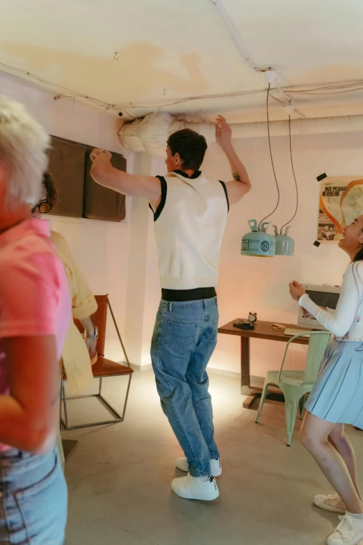 a group of people that are standing in a room, interactive art, 1950s vibes, the back rooms, he is dancing, studio lightning