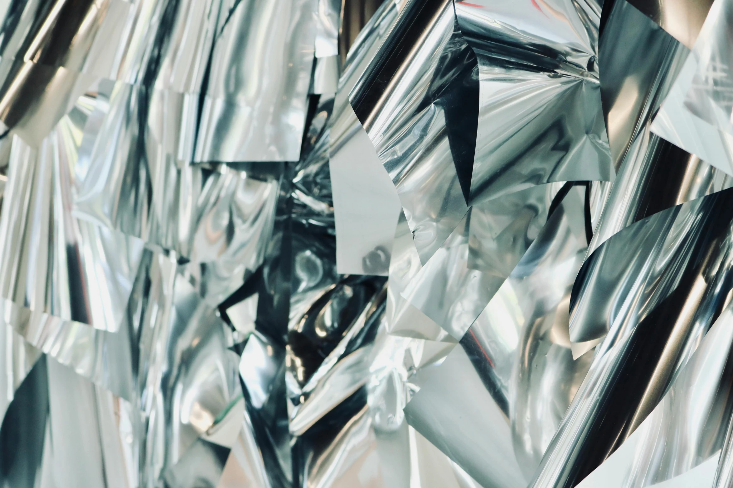 a close up of a piece of silver foil, inspired by John Chamberlain, pexels contest winner, crystal cubism, a crystalline room, [ metal ], “hyper realistic, yanjun chengt