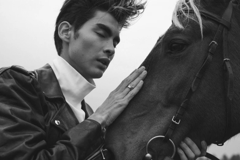 a black and white photo of a man petting a horse, by Emma Andijewska, photorealism, fashion magazine editorial, cai xukun, artgerm and patrick demarchelier, 15081959 21121991 01012000 4k