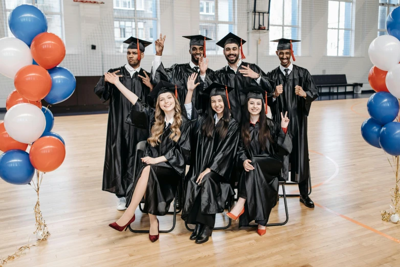 a group of people in graduation gowns posing for a picture, a portrait, by Nina Hamnett, pexels contest winner, full body 8k, thumbnail, diverse costumes, promotional image