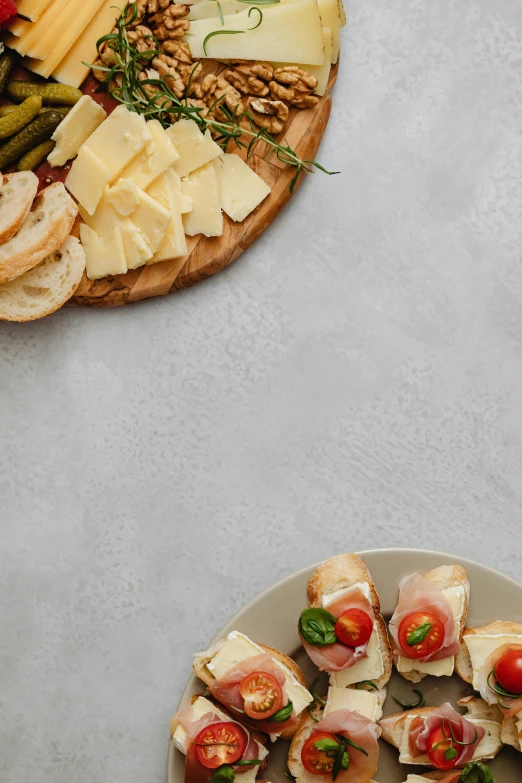 a close up of a plate of food on a table, cheeses, on a gray background, no text!, sparkling