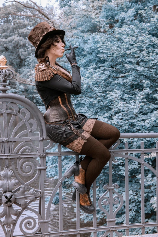 a woman sitting on a fence smoking a cigarette, inspired by Jules Robert Auguste, unsplash, baroque, wearing steampunk attire, brown and cyan color scheme, thighs, wearing a tophat