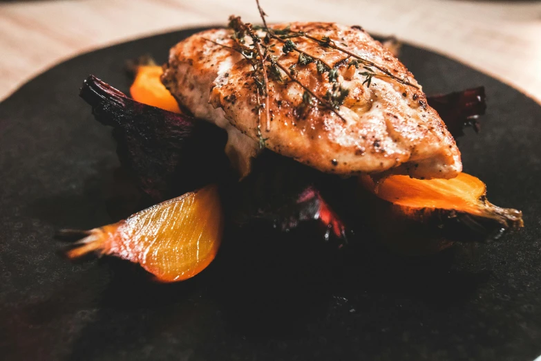 a close up of a plate of food on a table, pexels contest winner, chicken, maroon, dark grey and orange colours, filleting technique