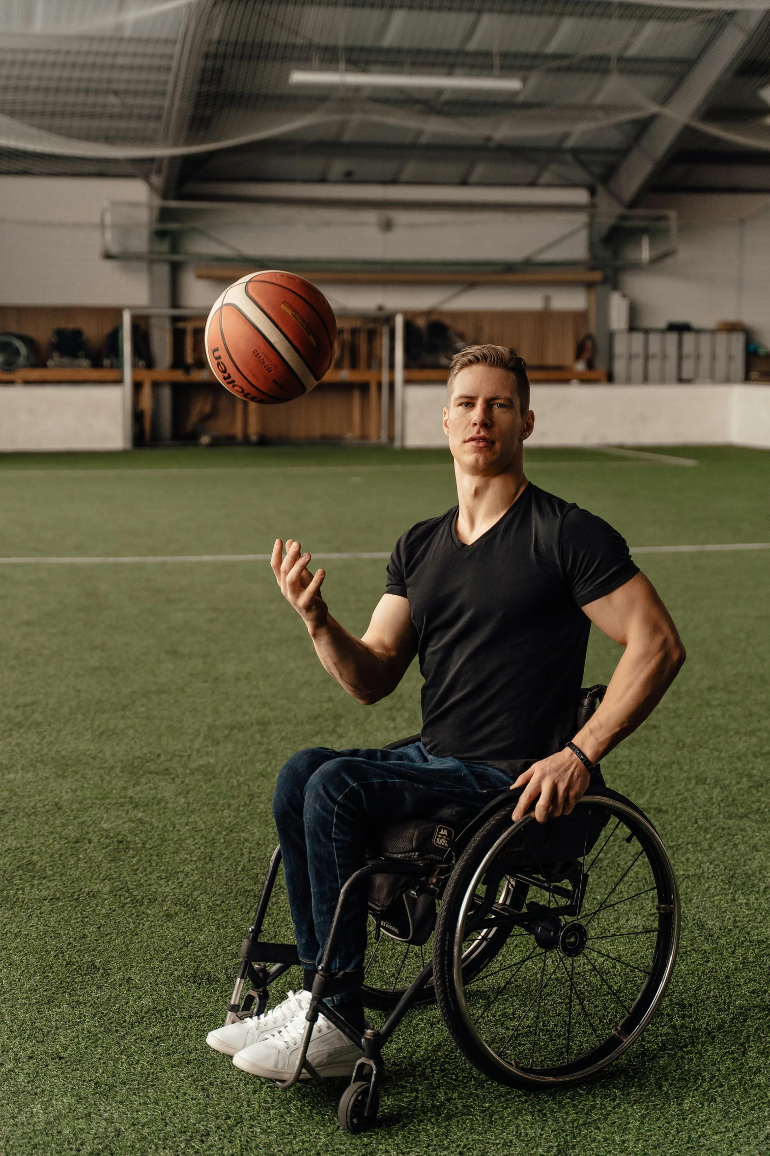 a man in a wheel chair throwing a basketball, soccer player timo werner, athletic tall handsome guys, promo image, jen bartel